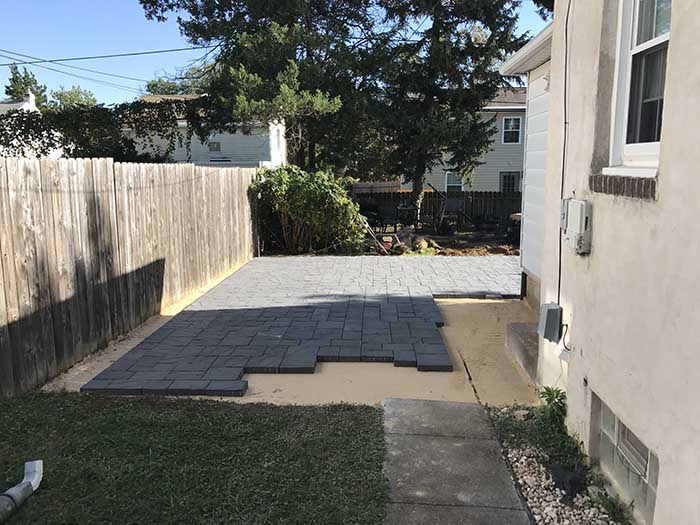 Sand barrier to level the patio